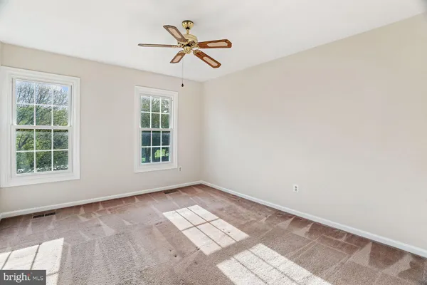 a view of empty room with windows