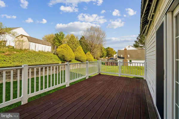 a view of a balcony with wooden floor