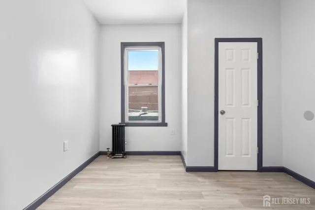 a view of an empty room and window