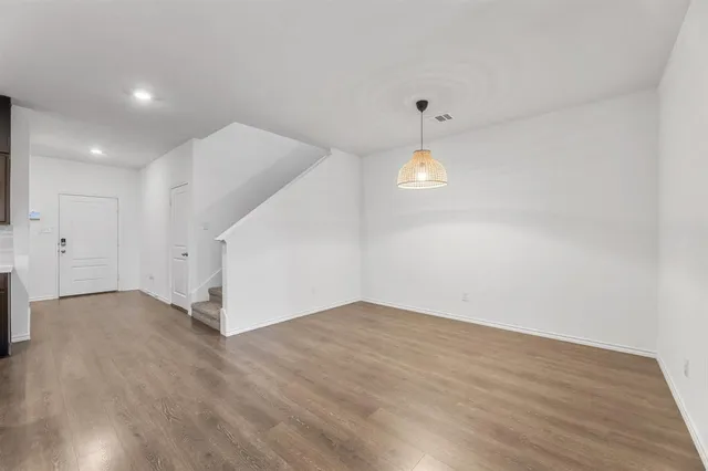 a kitchen with cabinets stainless steel appliances and a counter space