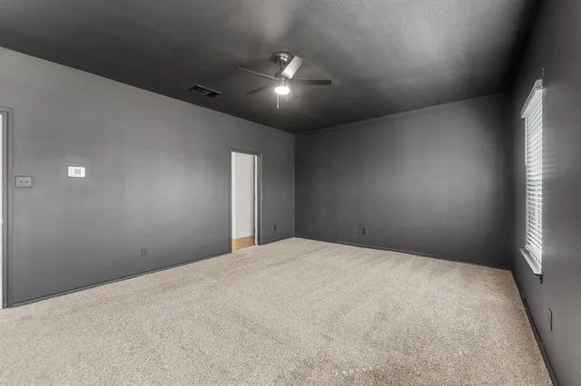 a view of a room that has a window in it