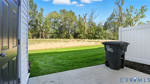 a view of a yard with an outdoor seating