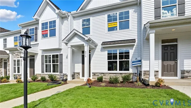 a view of a house with a yard and plants