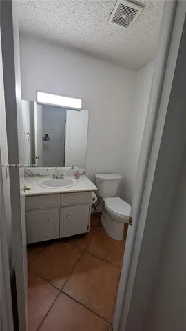 a bathroom with a toilet and shower