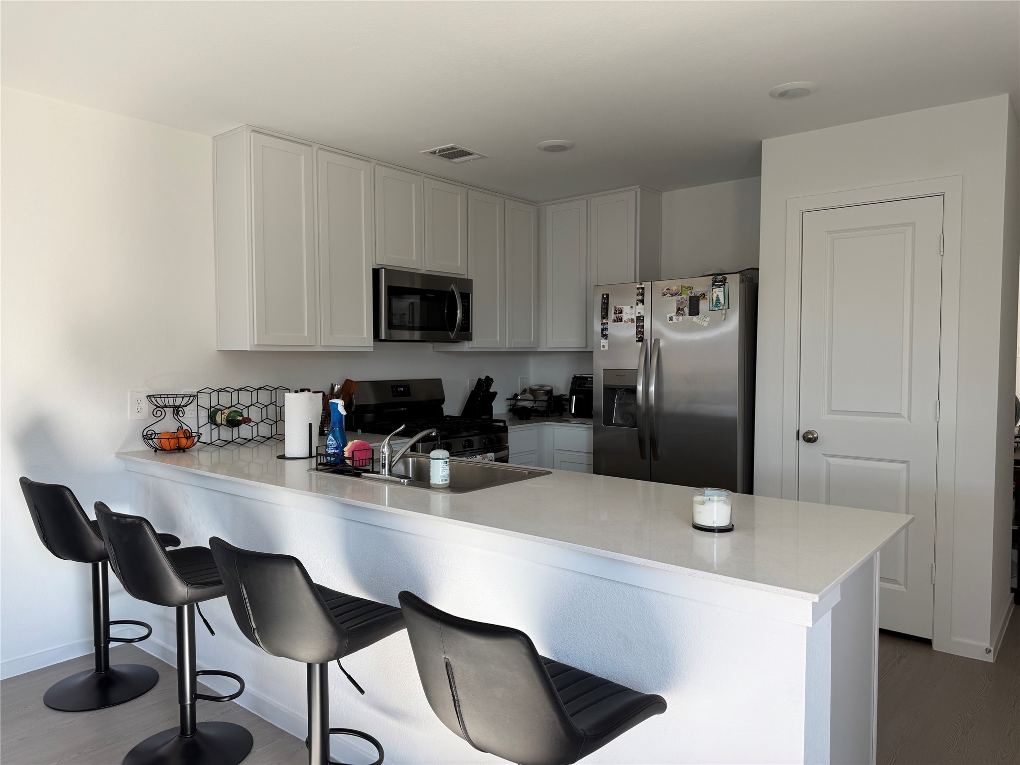16722 Largetooth Aspen Lane New Caney, TX 77357 - Photo 1 of 37 a kitchen with stainless steel appliances a sink cabinets and refrigerator