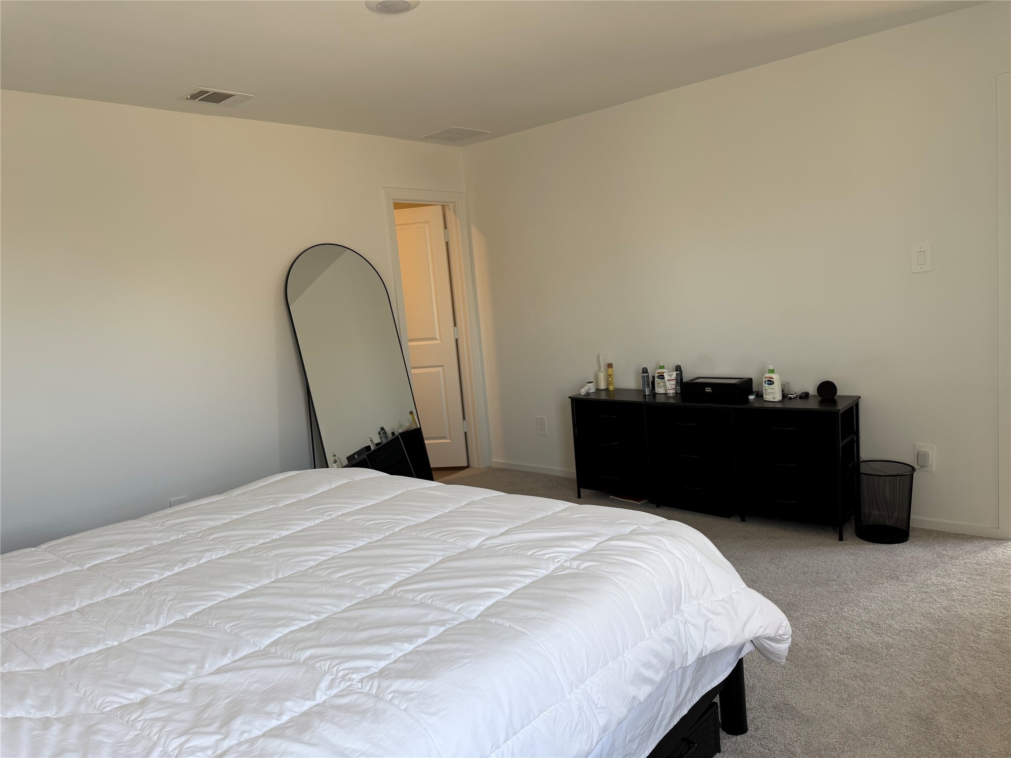 16722 Largetooth Aspen Lane New Caney, TX 77357 - Photo 11 of 37 a bedroom with a bed and a dresser