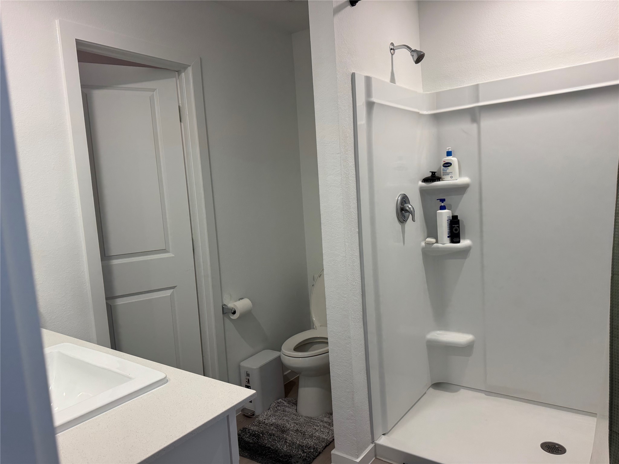 16722 Largetooth Aspen Lane New Caney, TX 77357 - Photo 13 of 37 a bathroom with a toilet and a shower