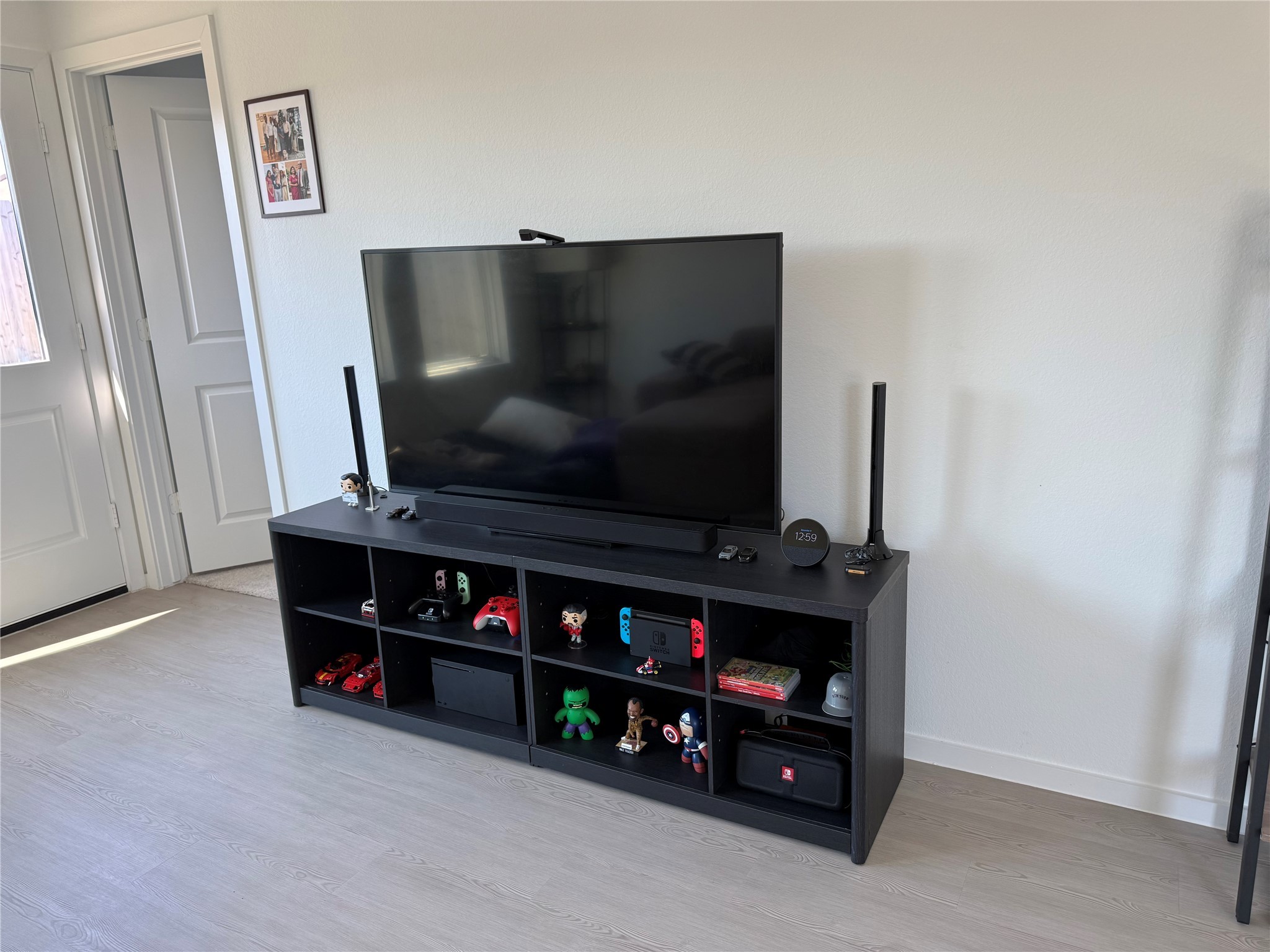 16722 Largetooth Aspen Lane New Caney, TX 77357 - Photo 18 of 37 a room with furniture and a flat screen tv