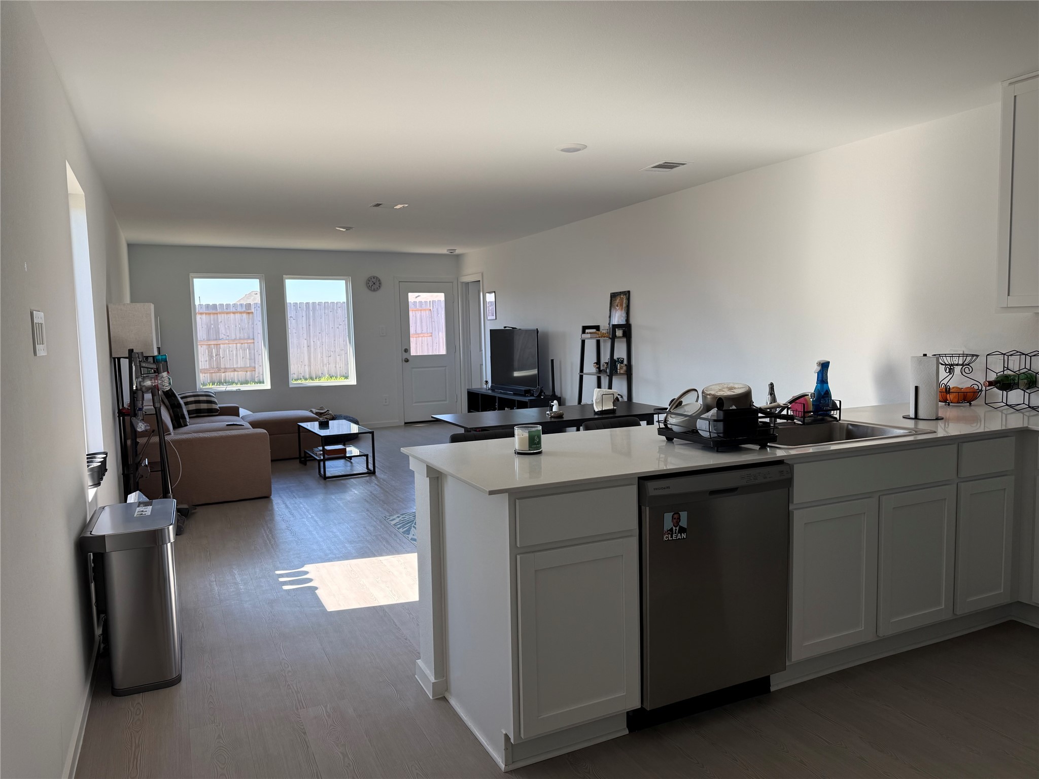 16722 Largetooth Aspen Lane New Caney, TX 77357 - Photo 26 of 37 a kitchen with sink stove and cabinets