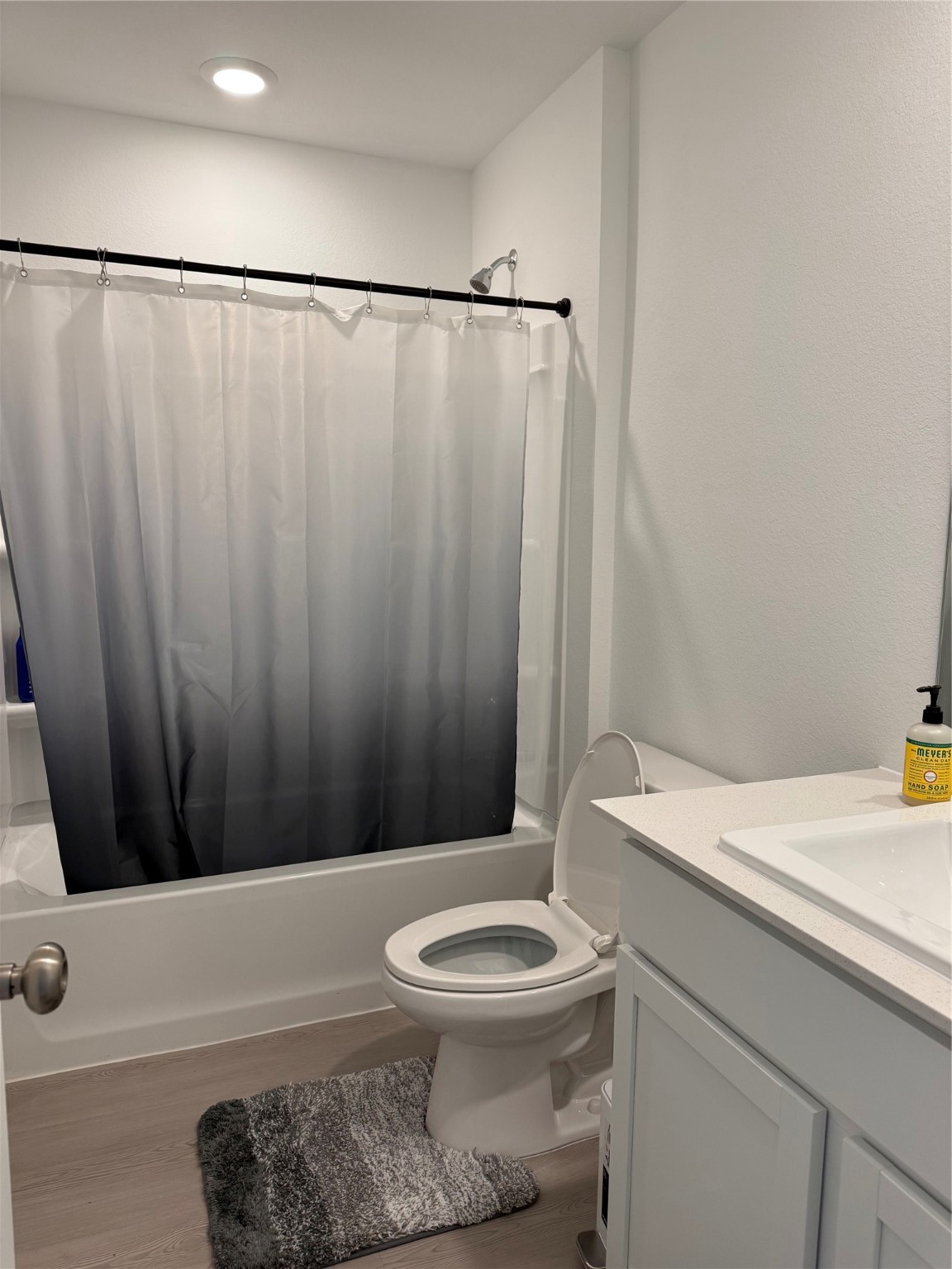 16722 Largetooth Aspen Lane New Caney, TX 77357 - Photo 32 of 37 a bathroom with a sink a toilet a mirror and shower