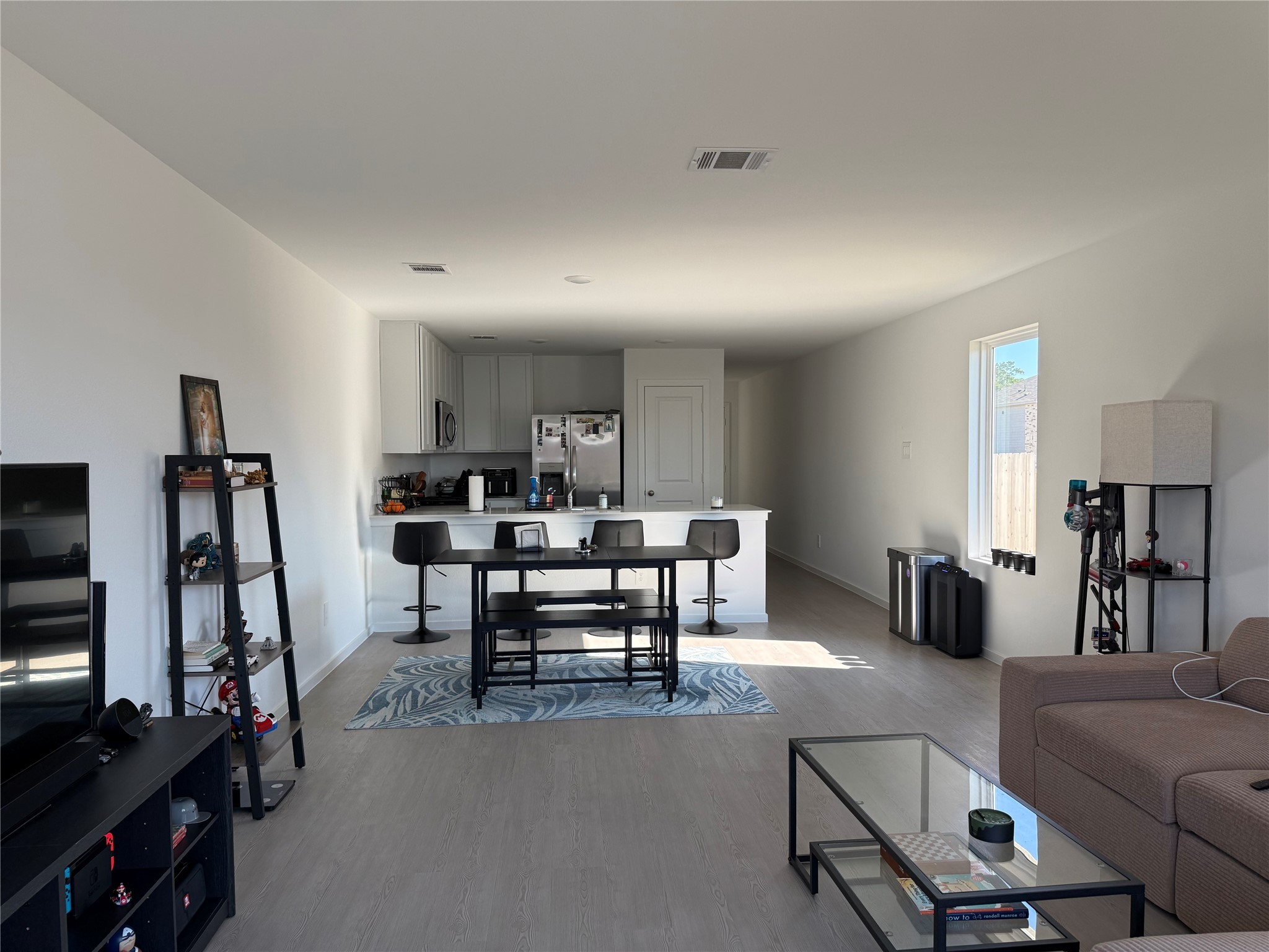 16722 Largetooth Aspen Lane New Caney, TX 77357 - Photo 8 of 37 a view of a livingroom with furniture and a flat screen tv