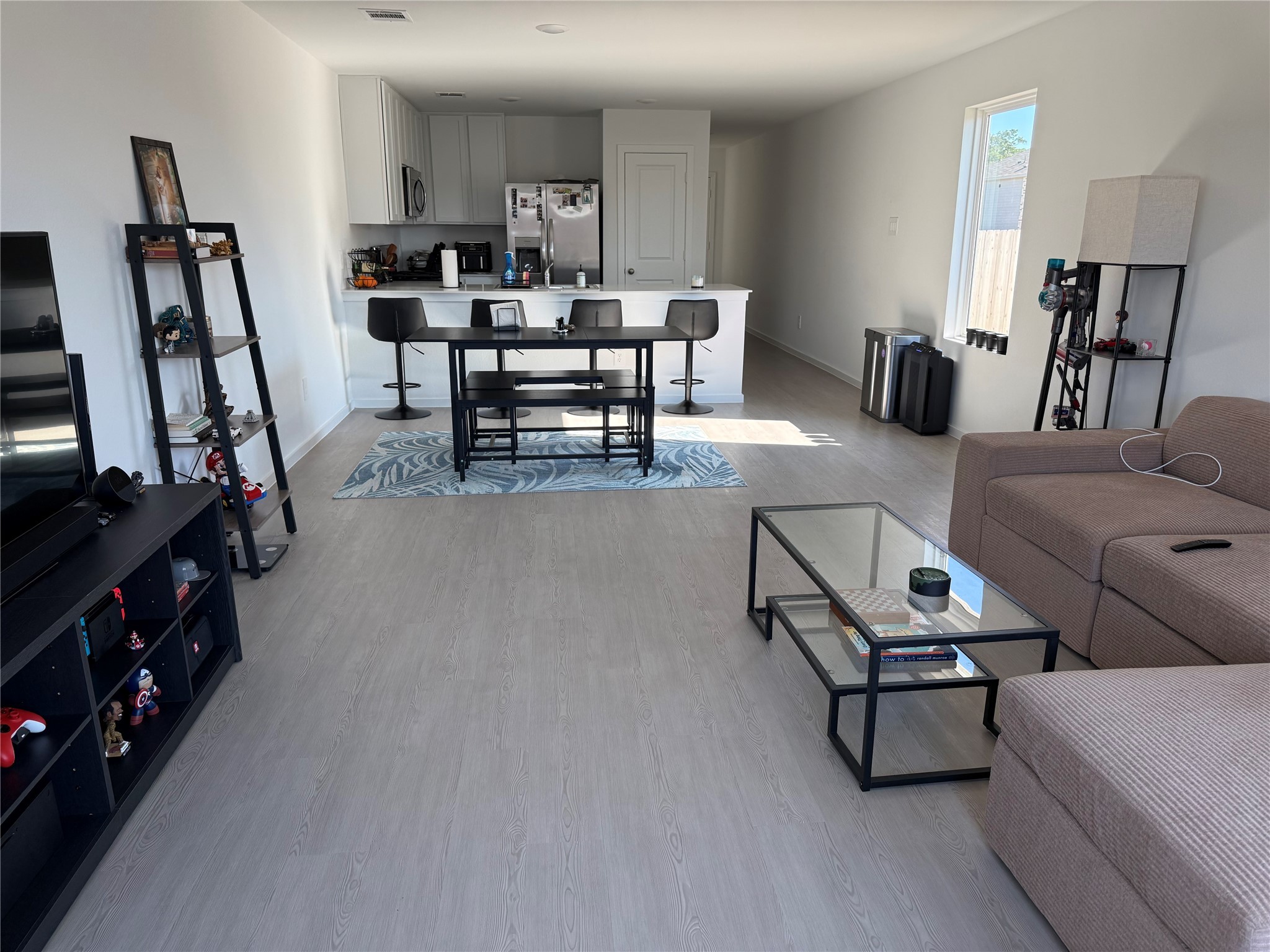 16722 Largetooth Aspen Lane New Caney, TX 77357 - Photo 9 of 37 a living room with furniture and a flat screen tv