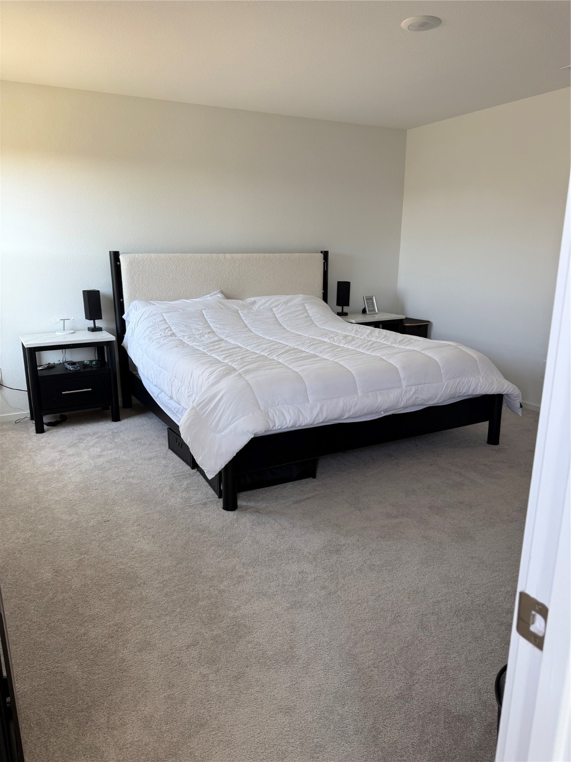 16722 Largetooth Aspen Lane New Caney, TX 77357 - Photo 10 of 37 a bedroom with a bed and a couch