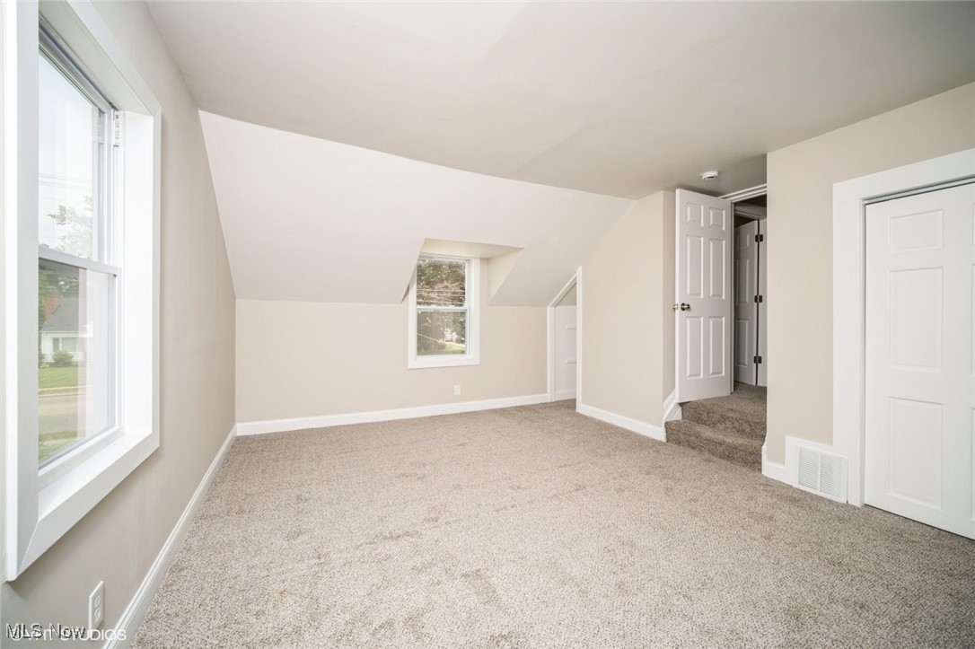 2188 North Taylor Road Cleveland Heights, OH 44112 - Photo 9 of 15 Bonus room with carpet flooring and vaulted ceiling