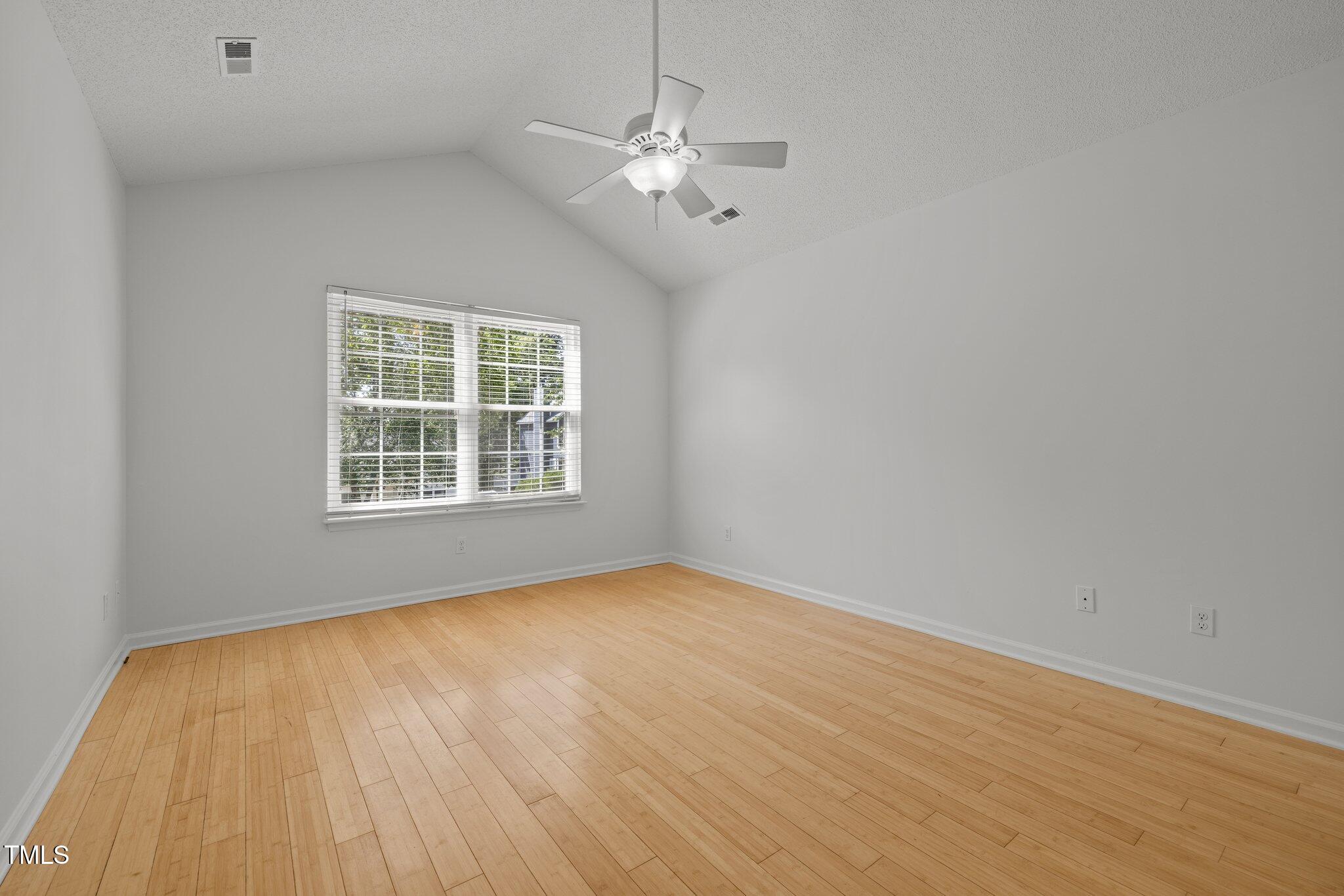 1040 Mills Street Raleigh, NC 27608 - Photo 15 of 21 wooden floor in an empty room with a window