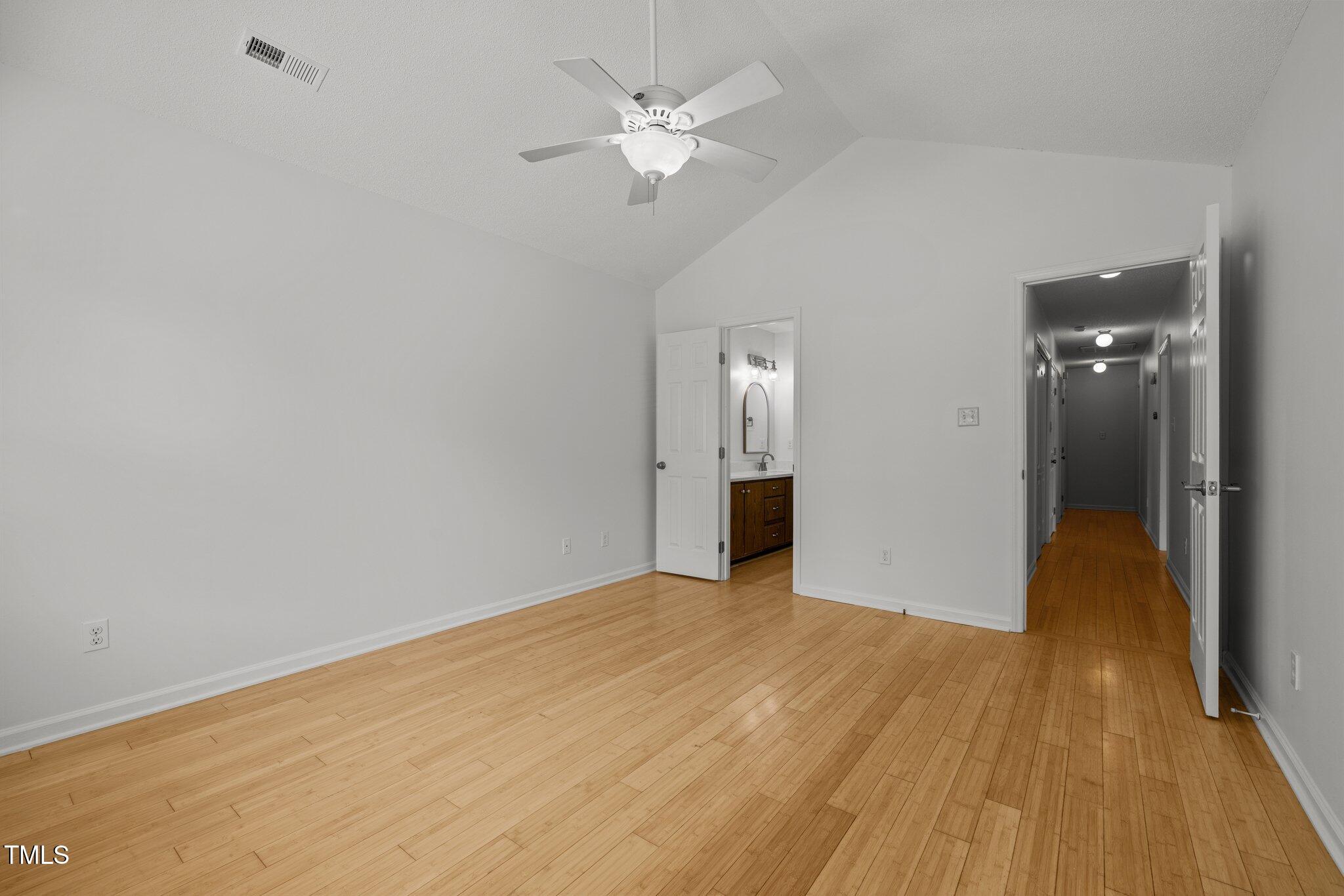 1040 Mills Street Raleigh, NC 27608 - Photo 16 of 21 wooden floor in an empty room with a window