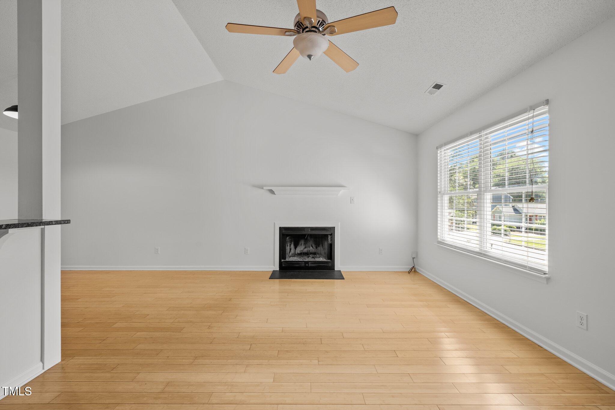 1040 Mills Street Raleigh, NC 27608 - Photo 3 of 21 a room with a fireplace and window