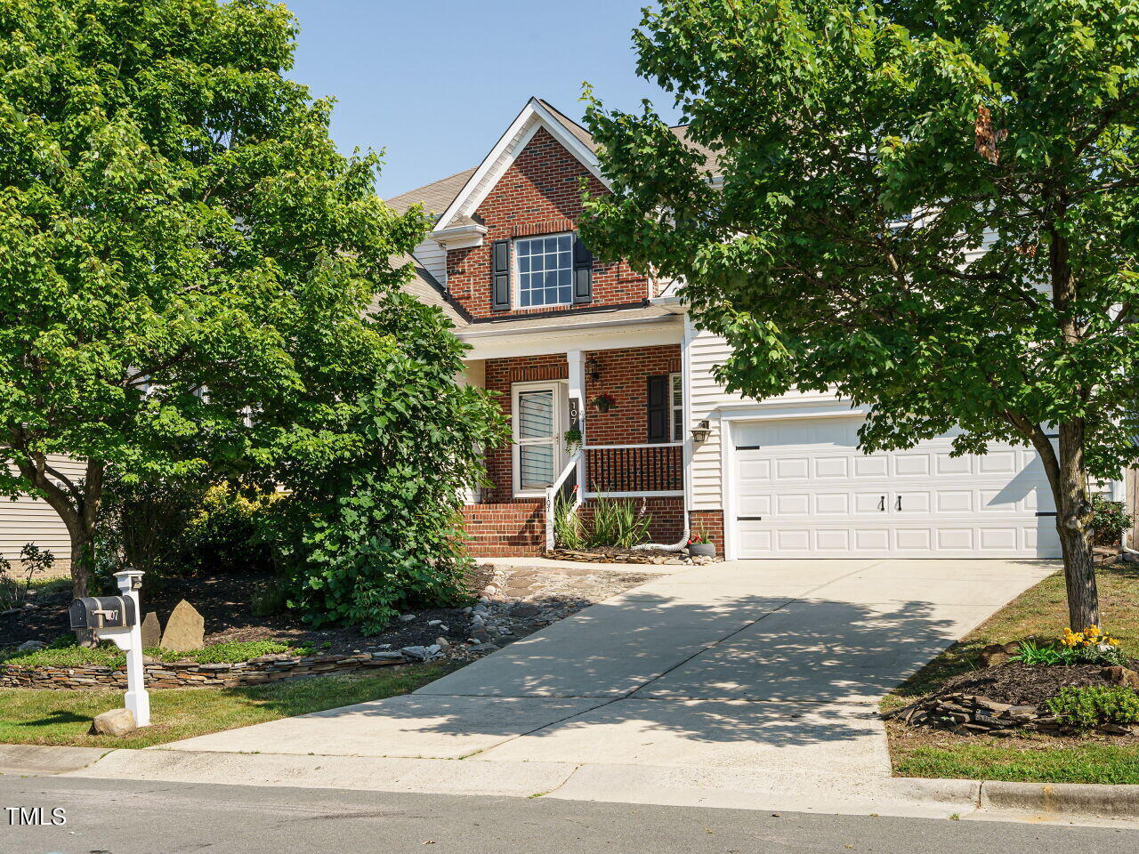 a front view of a house with street