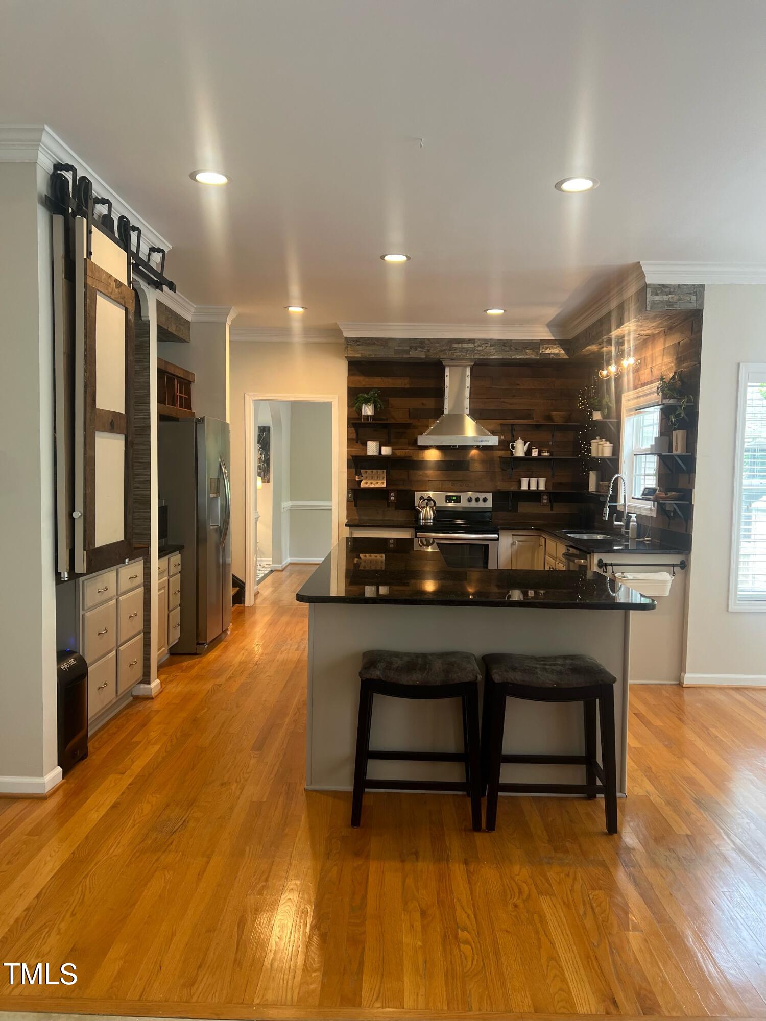 107 Whitney Lane Durham, NC 27713 - Photo 13 of 42 a hallway with a table and chairs