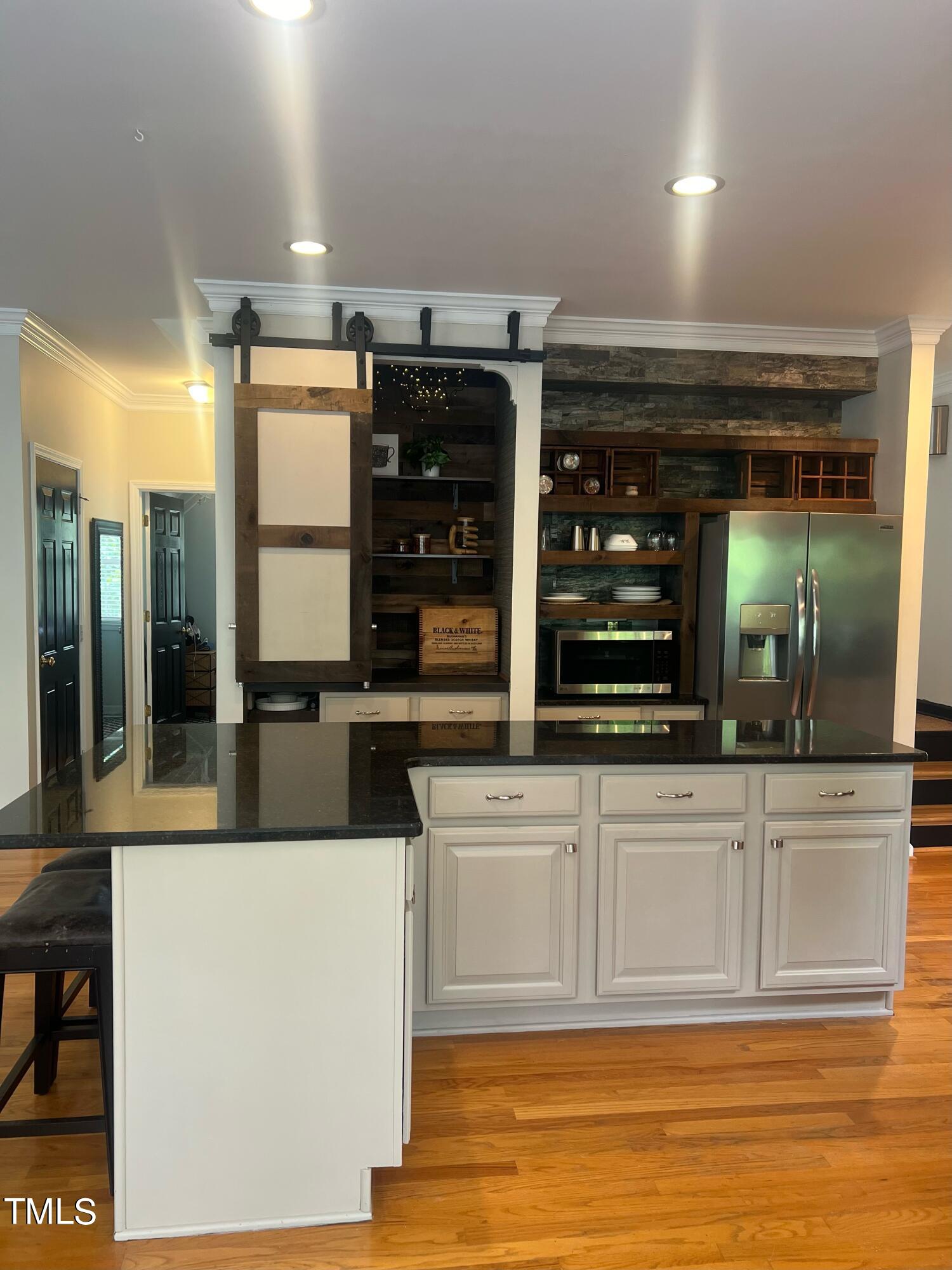 107 Whitney Lane Durham, NC 27713 - Photo 14 of 42 a kitchen with stainless steel appliances granite countertop a sink and cabinets