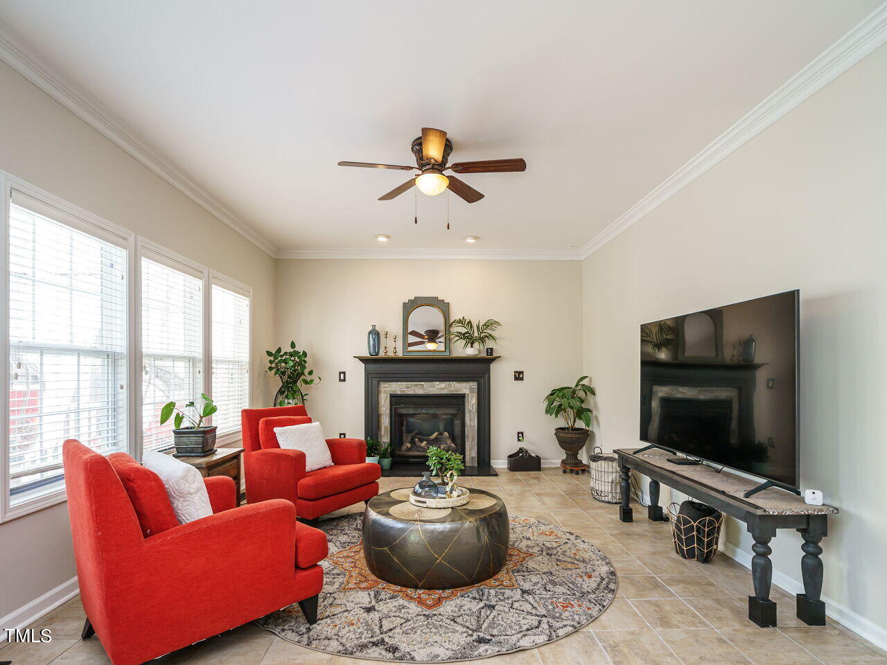 107 Whitney Lane Durham, NC 27713 - Photo 18 of 42 a living room with furniture a fireplace and a flat screen tv