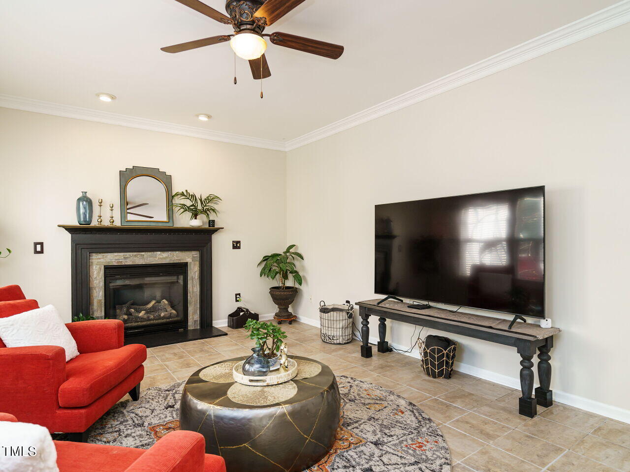 107 Whitney Lane Durham, NC 27713 - Photo 19 of 42 a living room with furniture and a fireplace