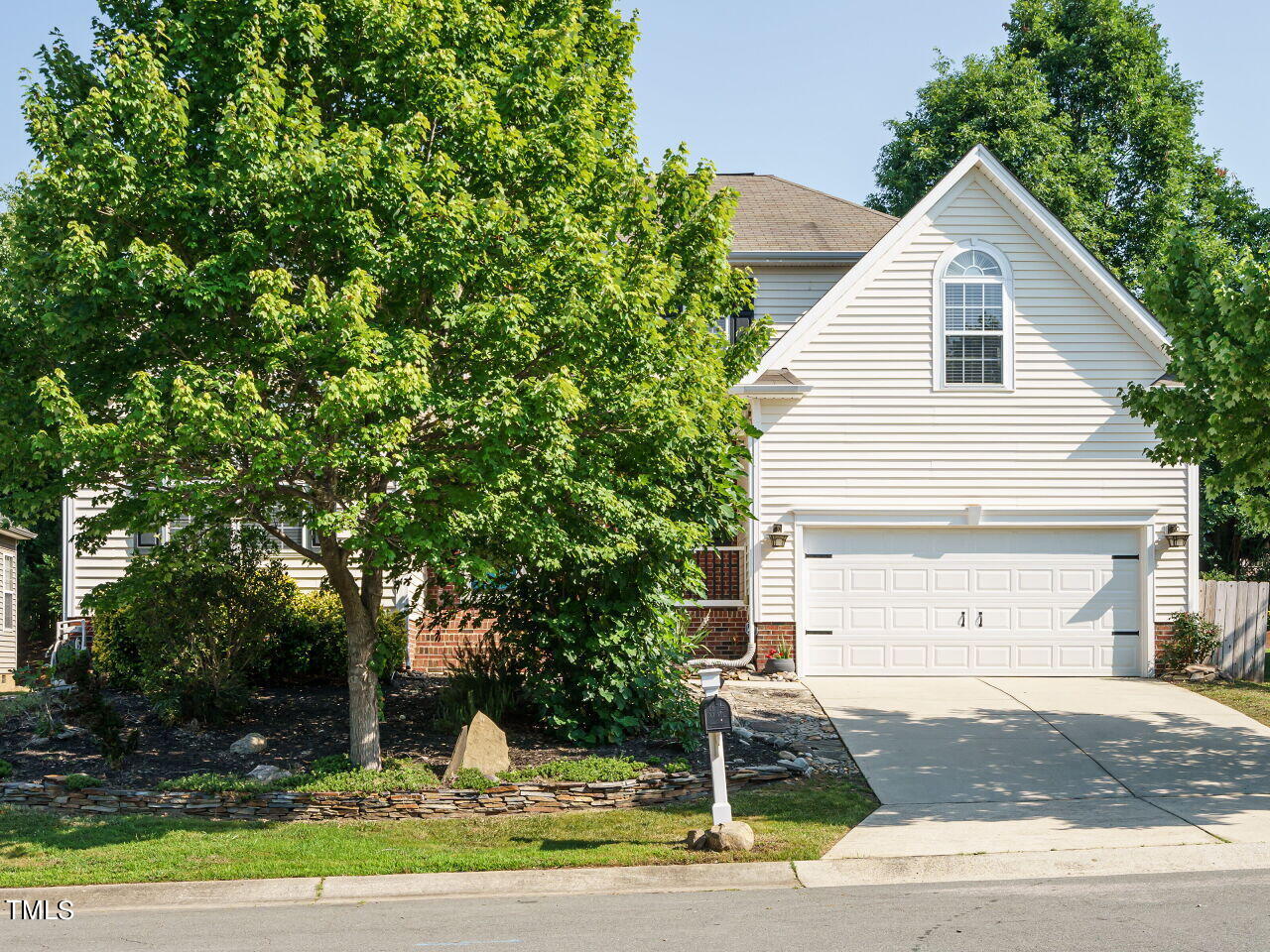 107 Whitney Lane Durham, NC 27713 - Photo 2 of 42 a front view of a house with garden