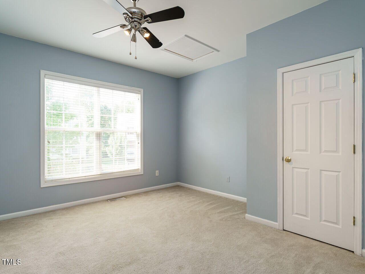 107 Whitney Lane Durham, NC 27713 - Photo 22 of 42 an empty room with windows and fan