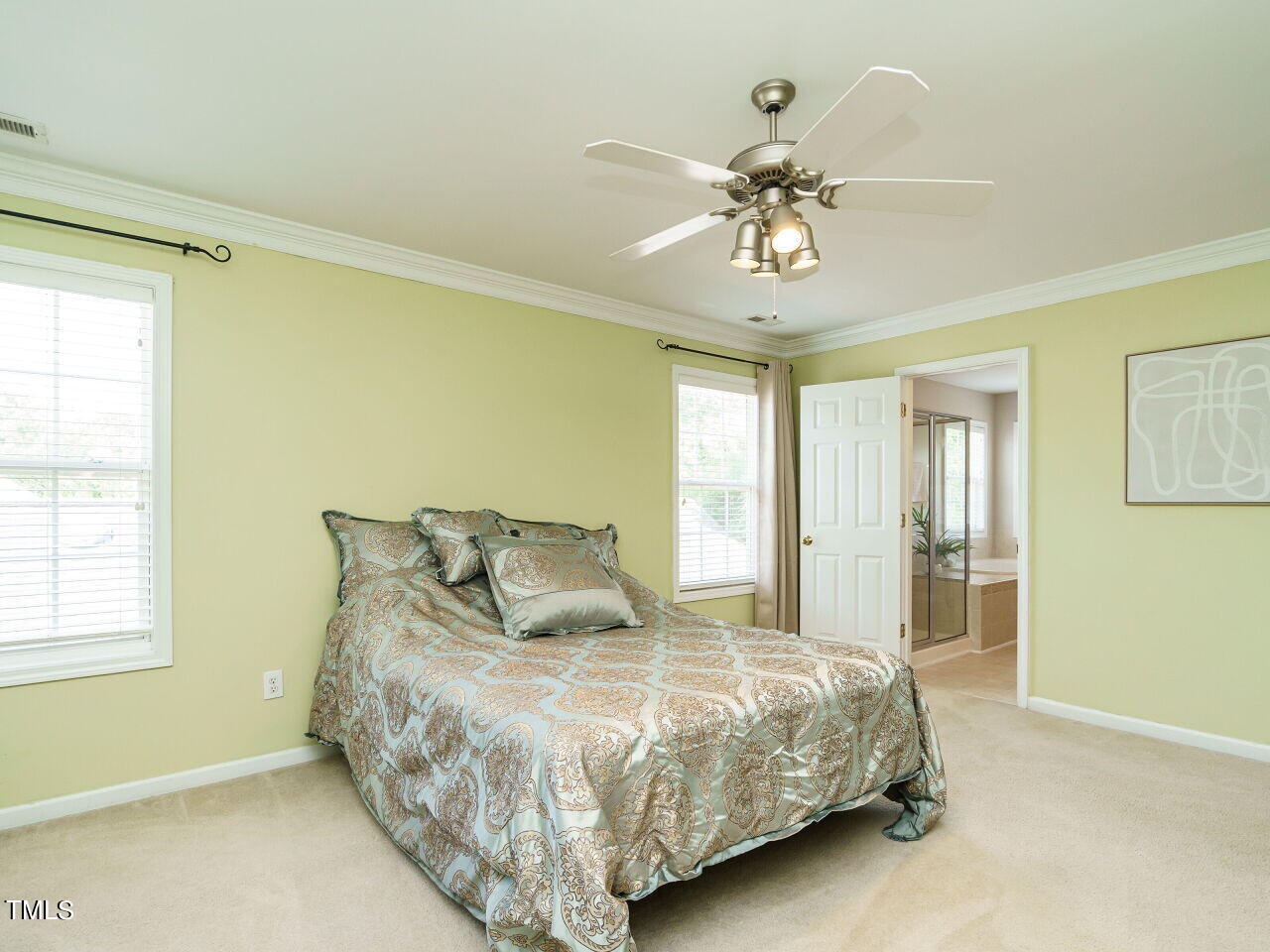 107 Whitney Lane Durham, NC 27713 - Photo 27 of 42 a bedroom with a bed and a chandelier