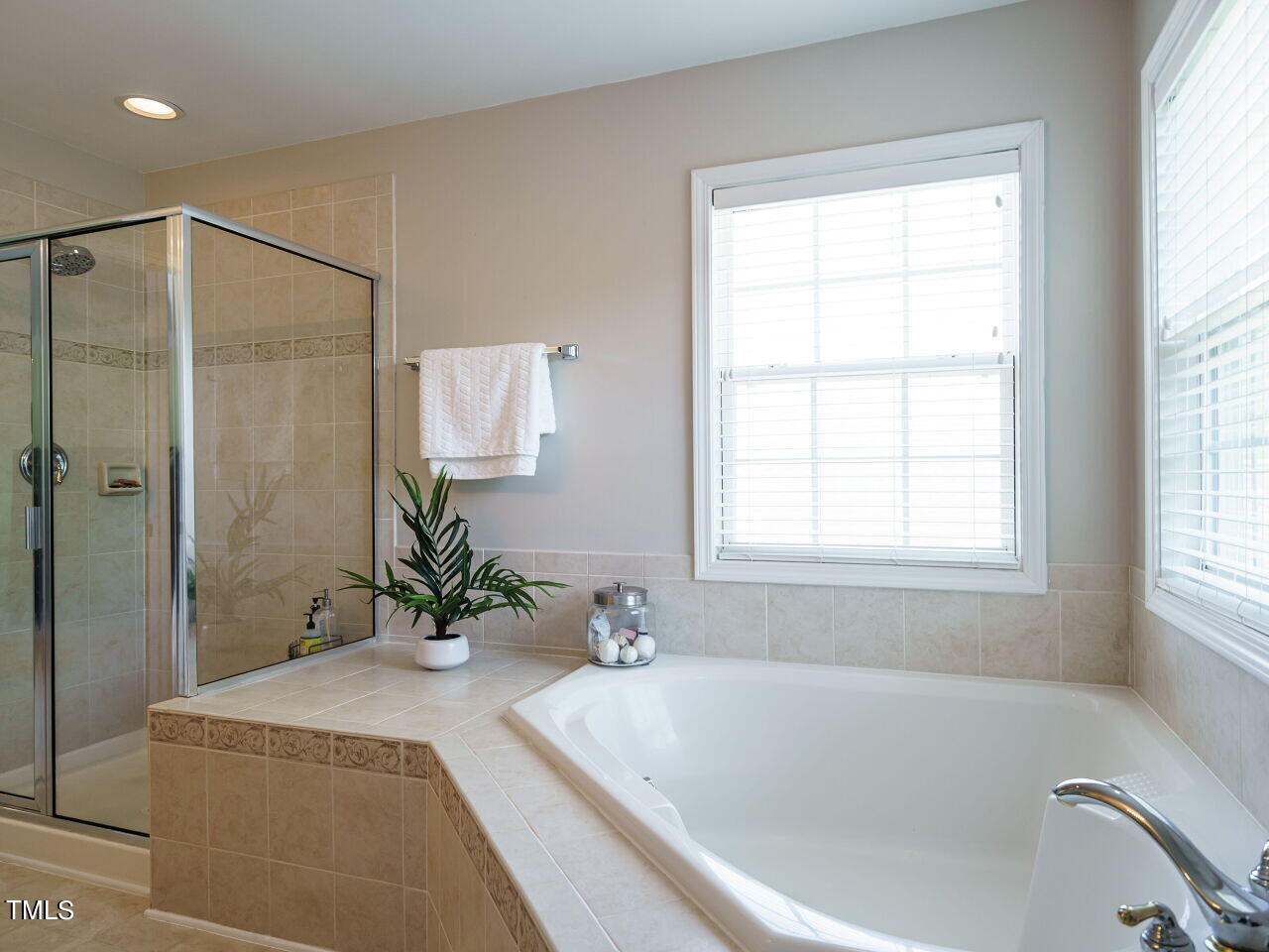 107 Whitney Lane Durham, NC 27713 - Photo 30 of 42 a white bath tub sitting next to a white sink