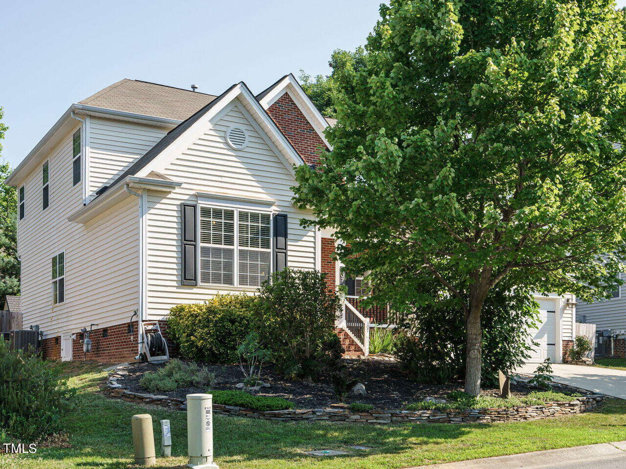 107 Whitney Lane Durham, NC 27713 - Photo 3 of 42 a view of house with yard and sitting area