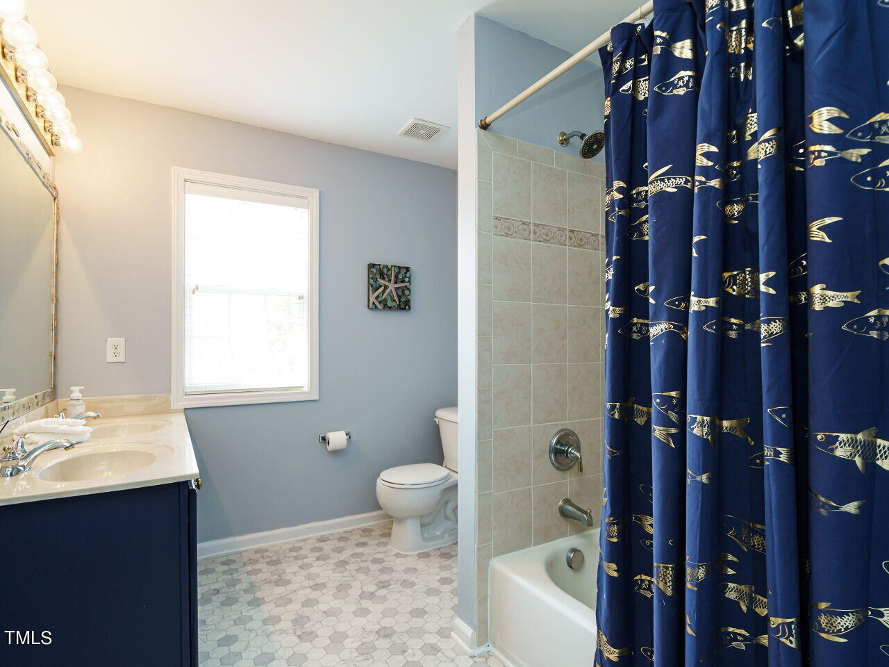 107 Whitney Lane Durham, NC 27713 - Photo 34 of 42 a bathroom with a sink toilet and shower