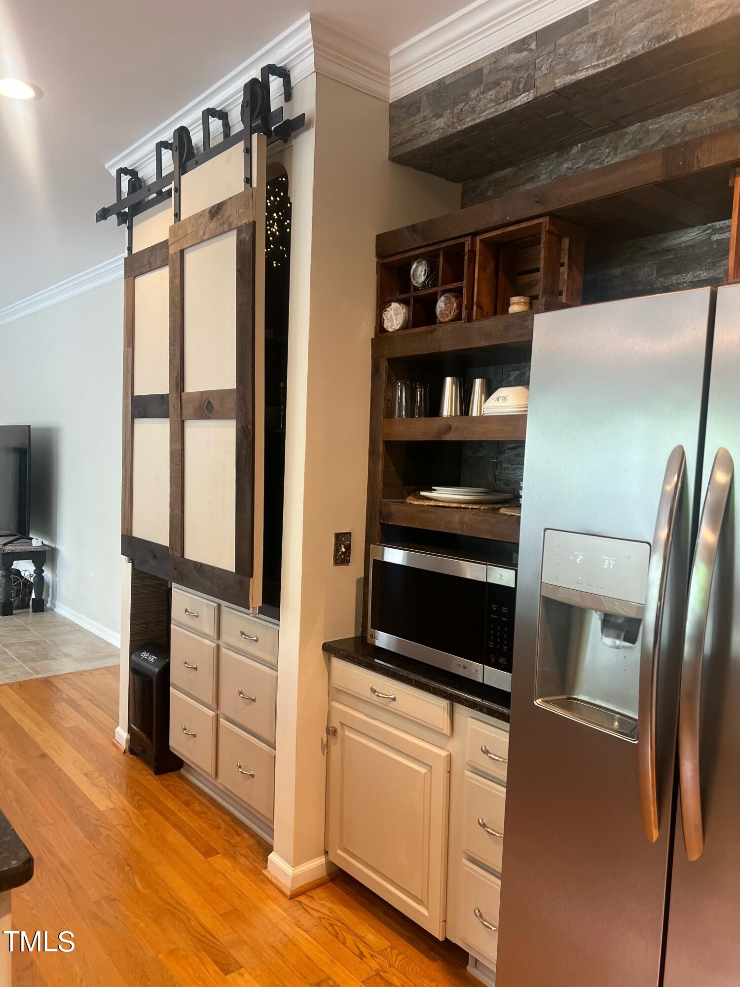 107 Whitney Lane Durham, NC 27713 - Photo 42 of 42 a kitchen with stainless steel appliances a refrigerator and cabinets