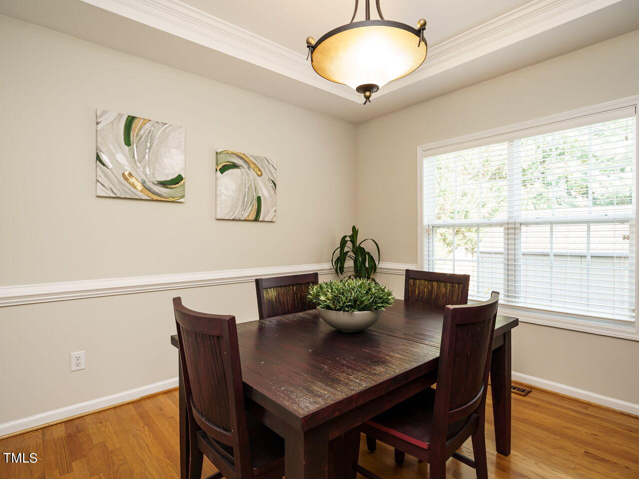 107 Whitney Lane Durham, NC 27713 - Photo 9 of 42 a view of a dining room with furniture window and wooden floor
