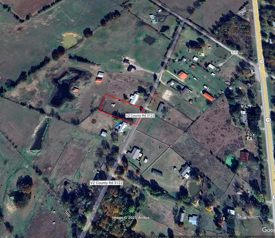 an aerial view of multiple houses with outdoor space