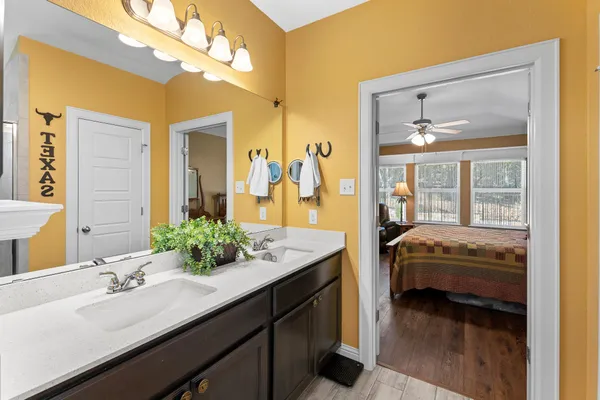 a en suite bathroom with a sink and a mirror
