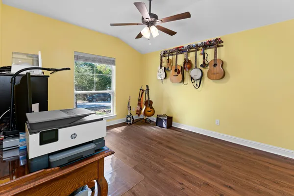 a room with furniture and wooden floor