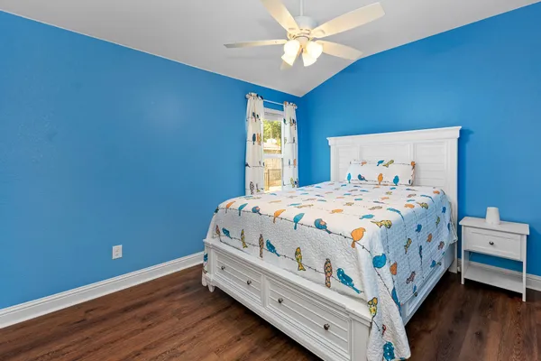 a bed room with a bed and a window