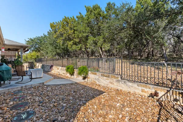 a view of a house with backyard sitting area and garden
