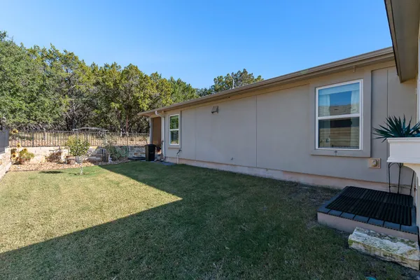 a view of a backyard with a patio