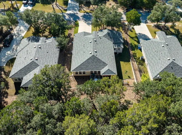 a view of a chair and tables in the balcony