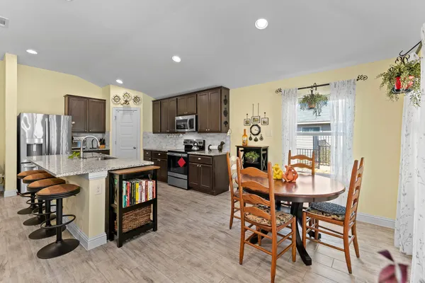 a view of a dining room with furniture and a livingroom