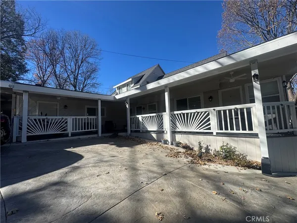 a front view of a house with stairs yard