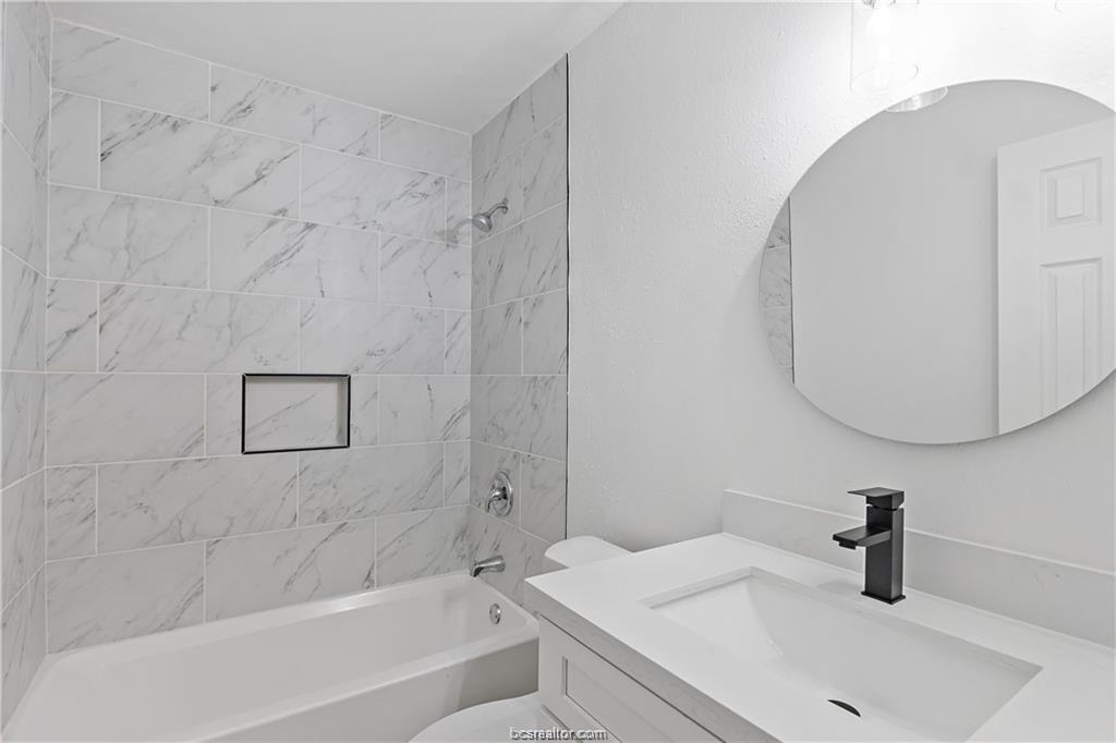 1503 Alpine Circle, Unit B College Station, TX 77840 - Photo 14 of 15 a bathroom with a sink and a mirror