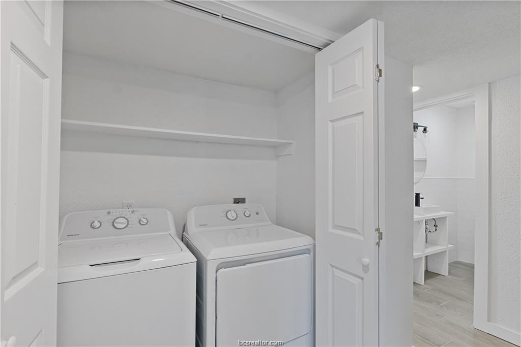 1503 Alpine Circle, Unit B College Station, TX 77840 - Photo 15 of 15 a view of washer and dryer with bathroom in the background