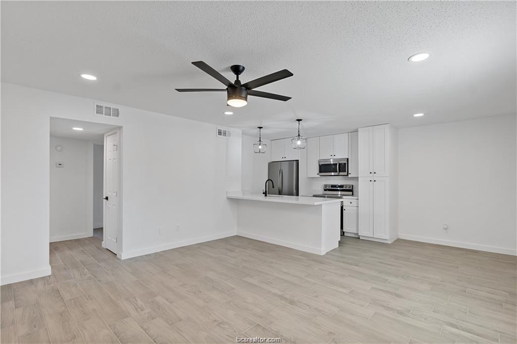 1503 Alpine Circle, Unit B College Station, TX 77840 - Photo 6 of 15 a view of kitchen with stainless steel appliances refrigerator oven and cabinets