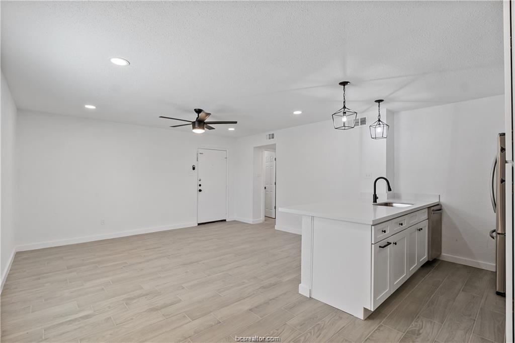 1503 Alpine Circle, Unit B College Station, TX 77840 - Photo 7 of 15 a view of a bathroom with a sink and chandelier