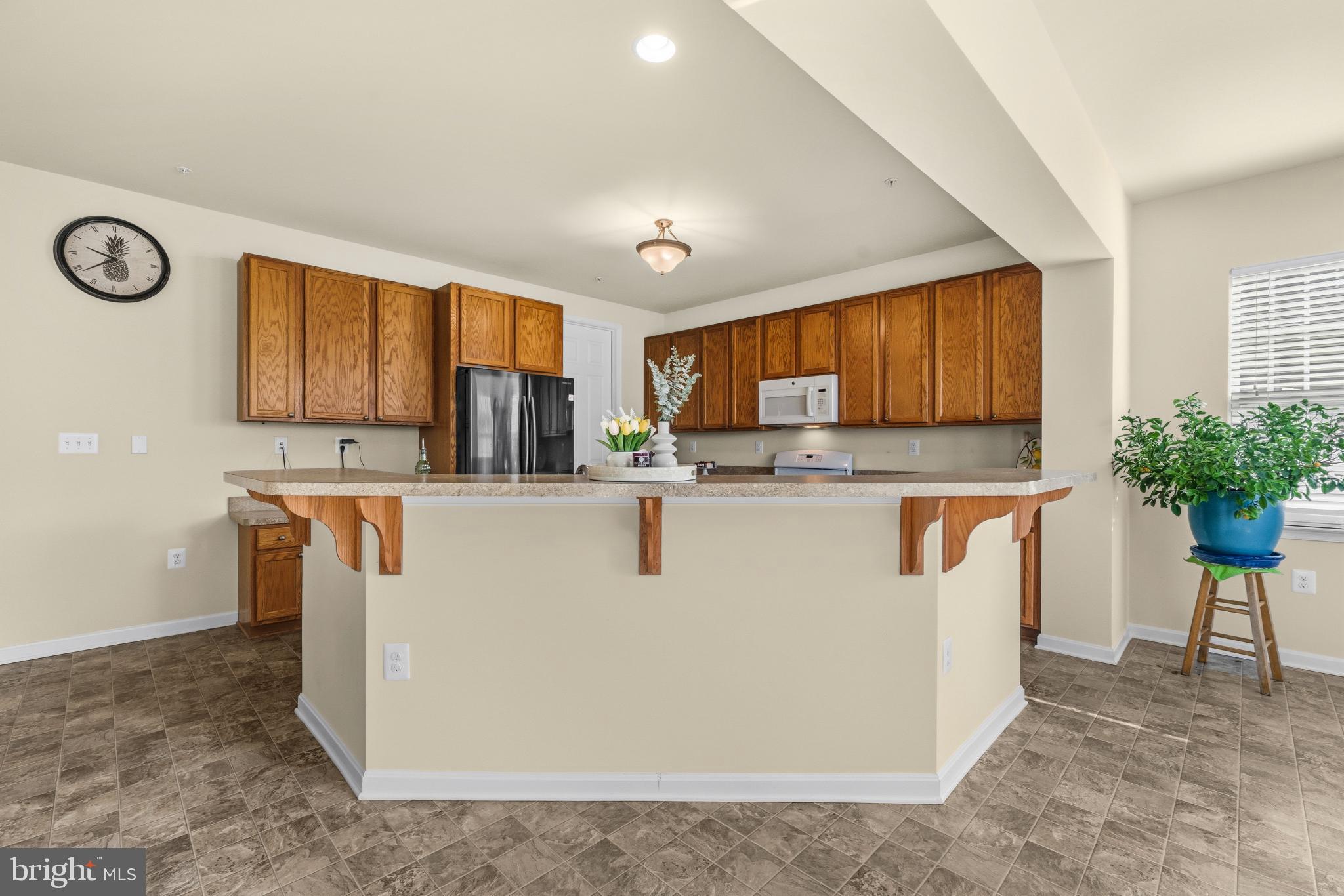 41377 Doctors Crossing Road Leonardtown, MD 20650 - Photo 12 of 62 There are enough space for 6 bar-height stools.