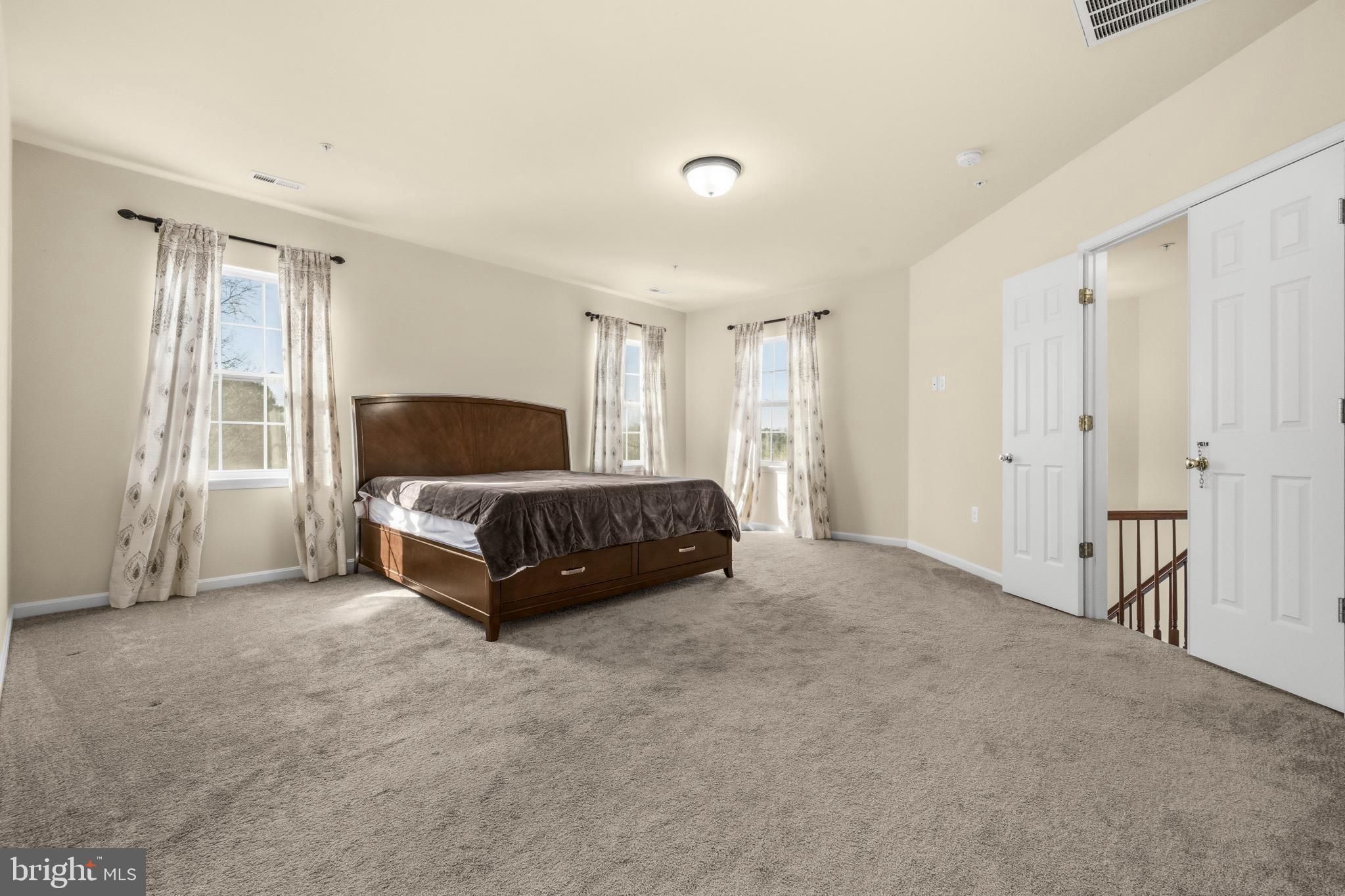 41377 Doctors Crossing Road Leonardtown, MD 20650 - Photo 31 of 62 Primary bedroom with king sized bed