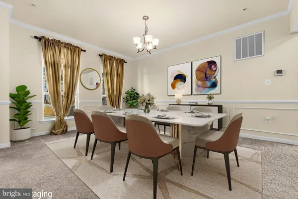 a living room with furniture and view of kitchen